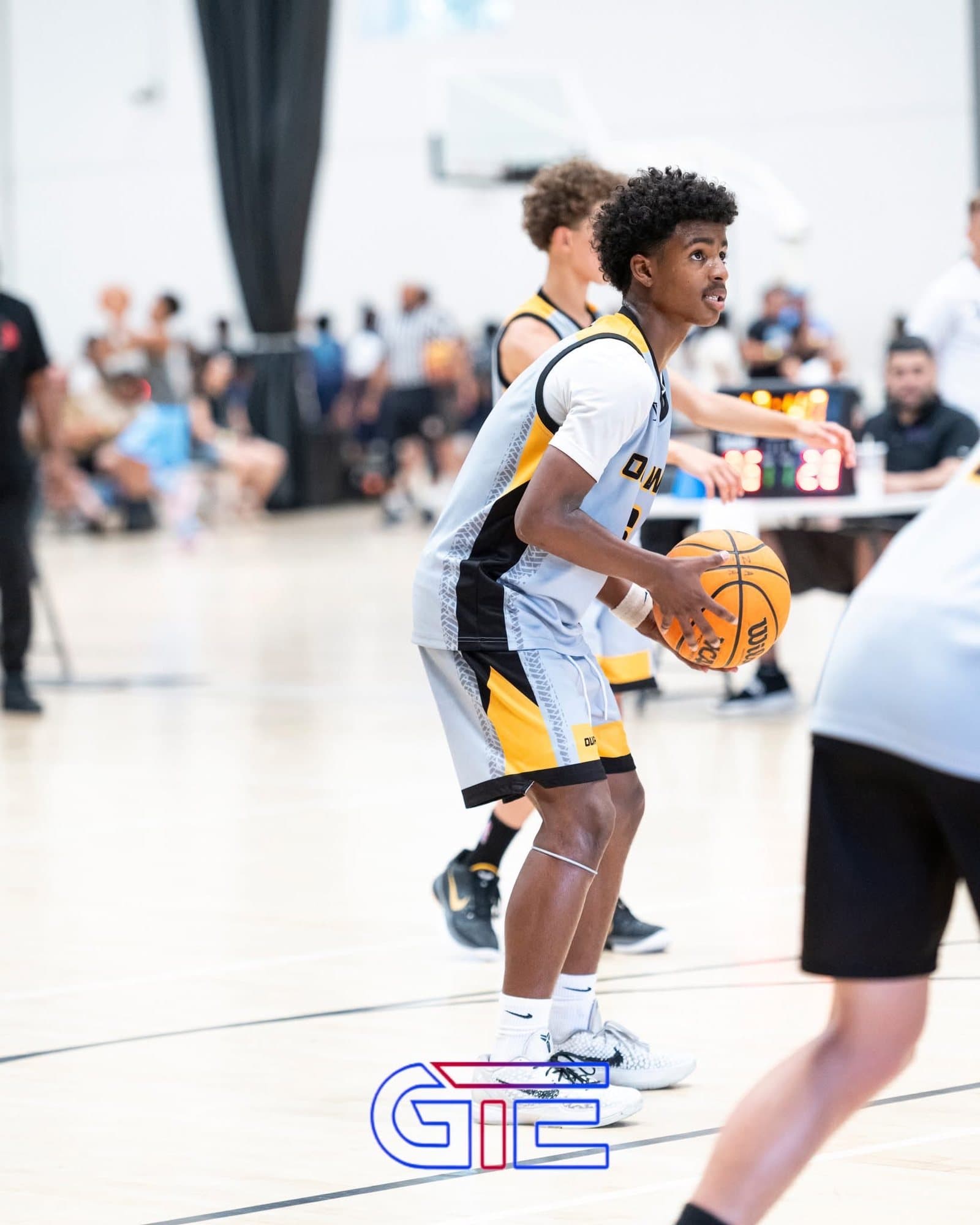 OW player holding the ball in triple-threat position