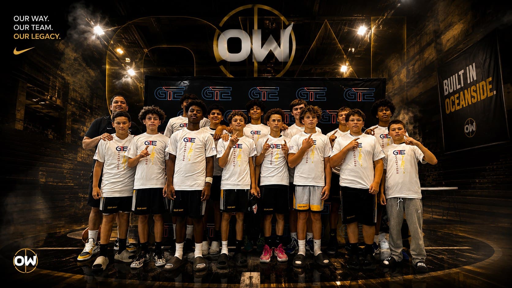 OW players and a coach in white GTE tees on the Our Way floor beneath the OW roundel